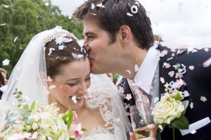 Bride and Groom in confetti shower